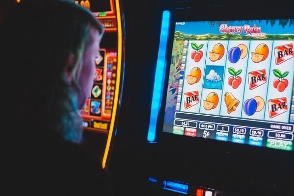 woman playing pokie