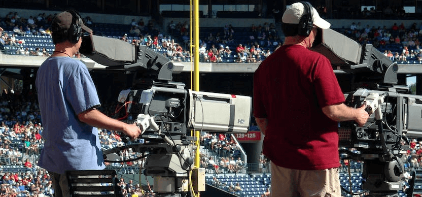 Camera crew Filming in a Sports arena