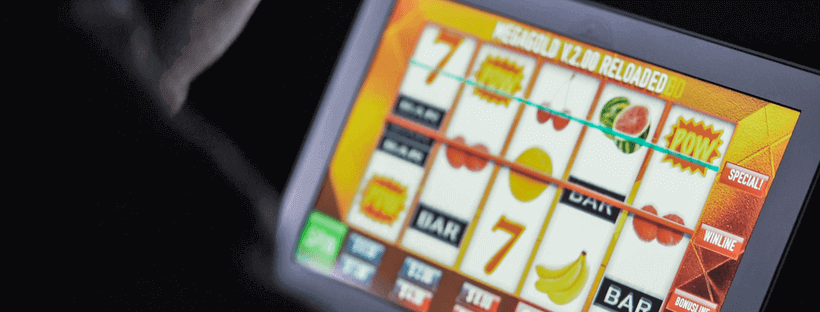 Aussie playing pokies on laptop screen