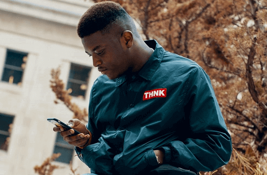 A man betting on sports on his phone